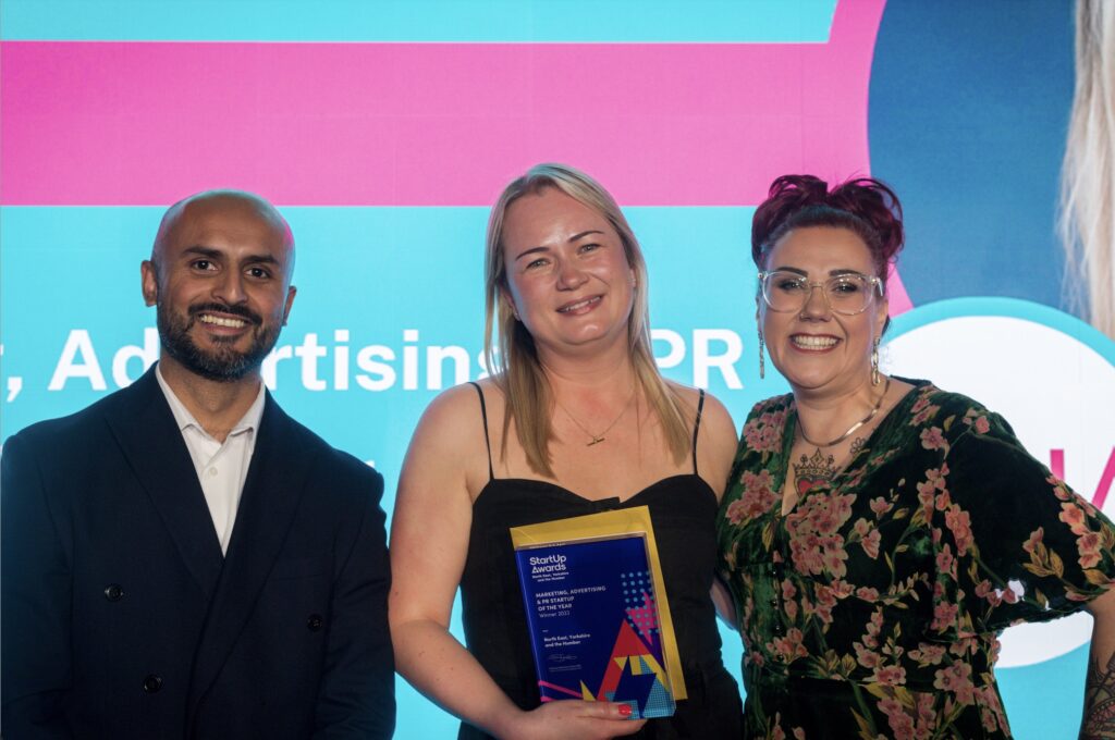Moja collecting an award at the Start Up awards ceremony